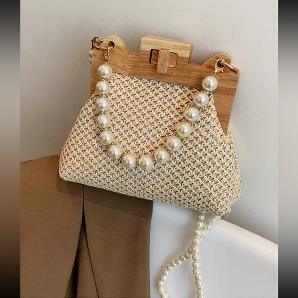 Woven straw lock pearl handbag